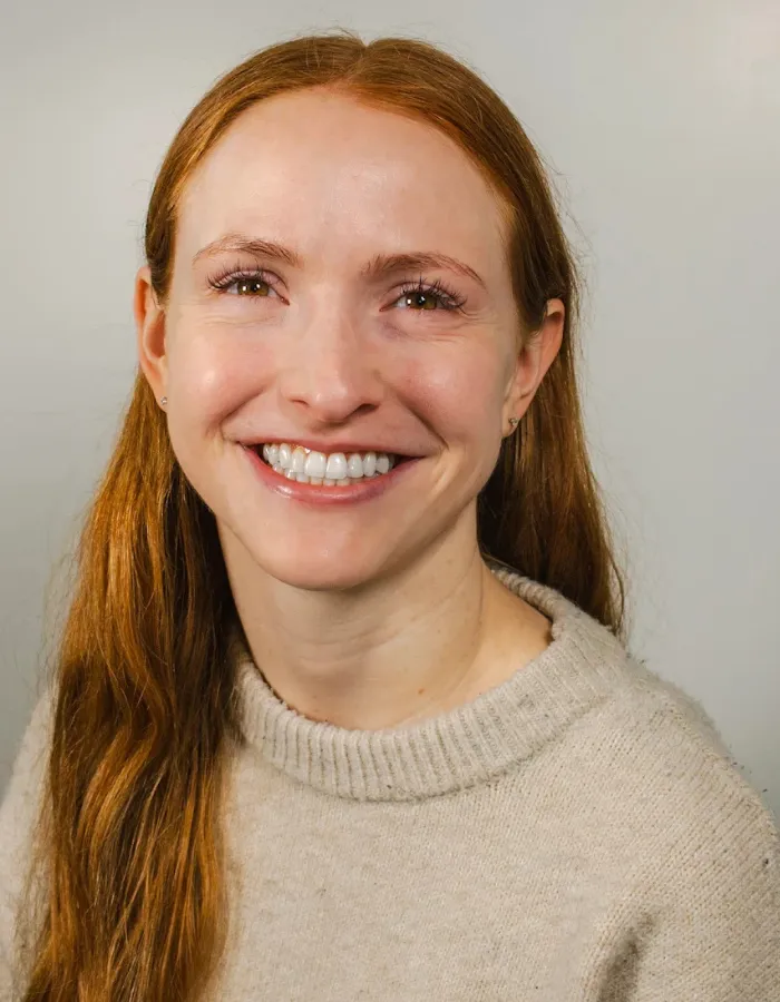 Kaitlyn Murray, smiling, in a cream knit sweater